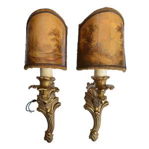 Paired bronze sconces in a hunting style