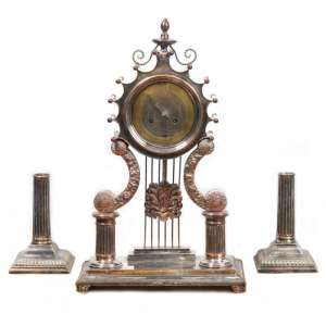 The set of clock and two candlesticks in the style of "neo-Gothic"