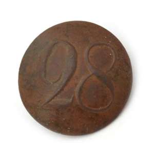 The regimental button with the number "28"
