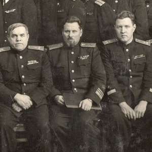 Photo of Vice-Admiral A. Frolov, surrounded by colleagues