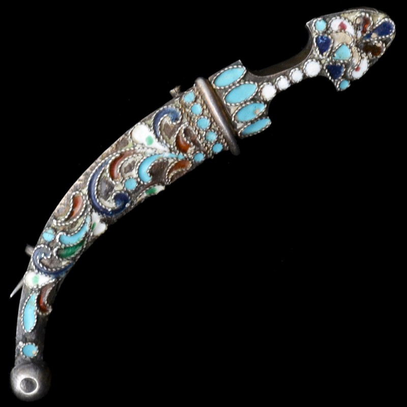 The brooch is made in the form of a Caucasian dagger (Bebutov)
