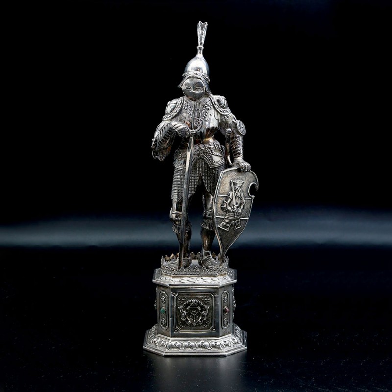 Silver figurine of a knight in armor