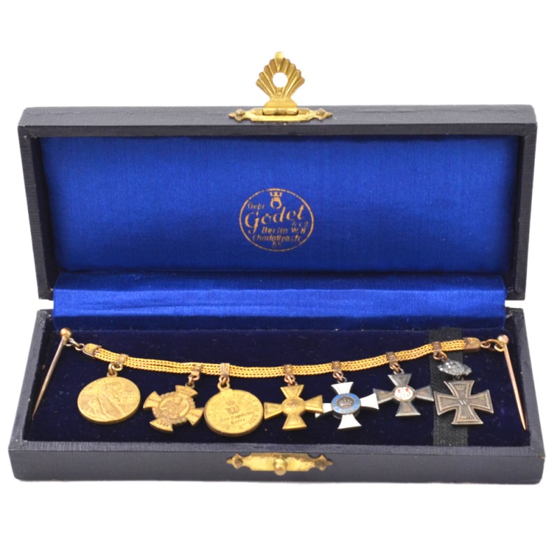 A set of miniature awards of a German soldier on a chain, in box