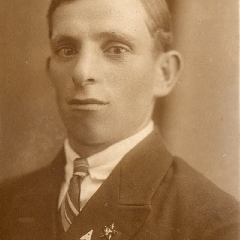 Photo of a young man with a patriotic glass star on his lapel