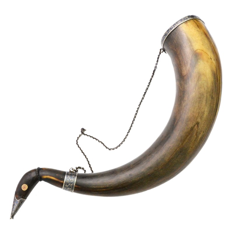 Massive wine horn decorated with silver