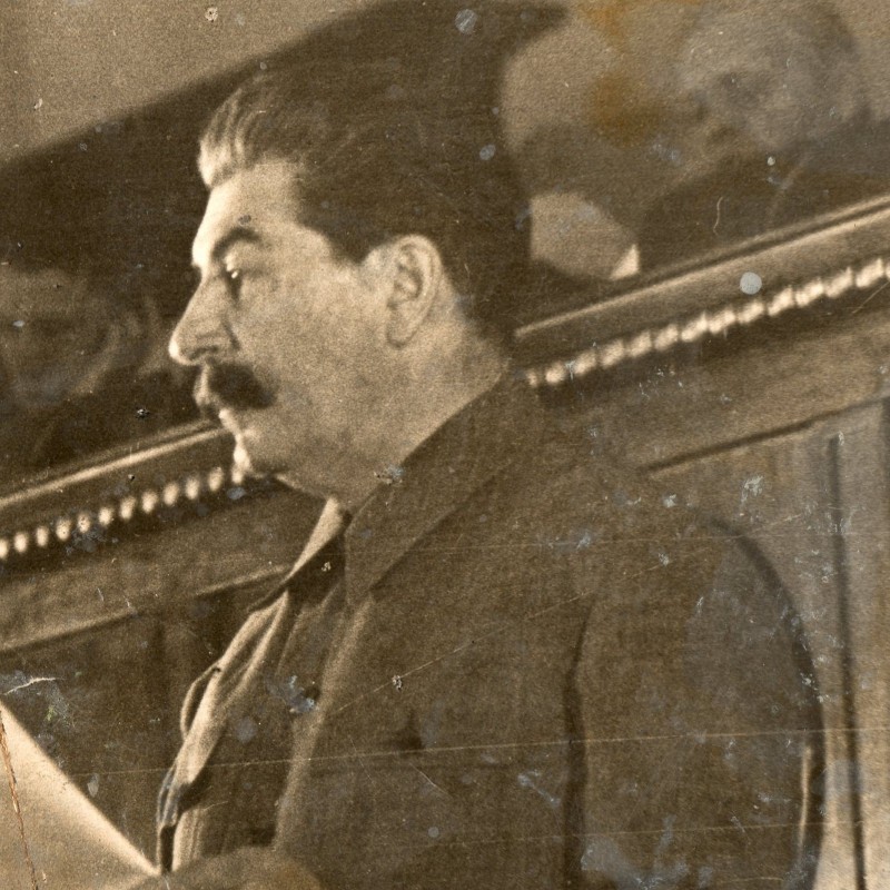 Photo of I.V. Stalin on the podium with a newspaper