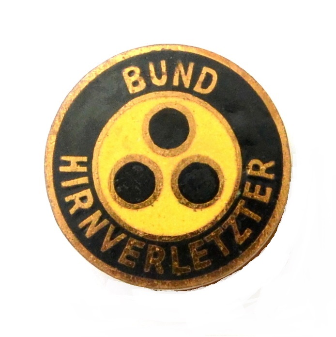 The badge of a veteran who lost his sight in the war, a buttonhole version