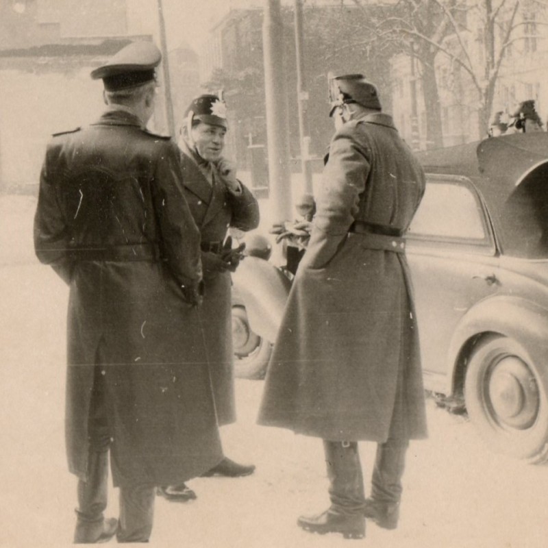 Photos of German policemen in shako at the car