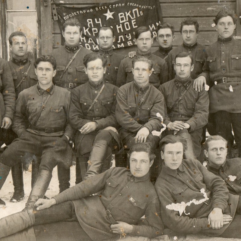 Photo of Red Army soldiers on the background of the banner