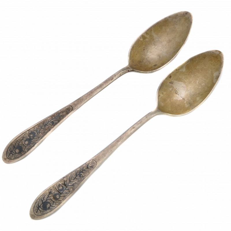 A pair of Soviet silver soup spoons decorated with black