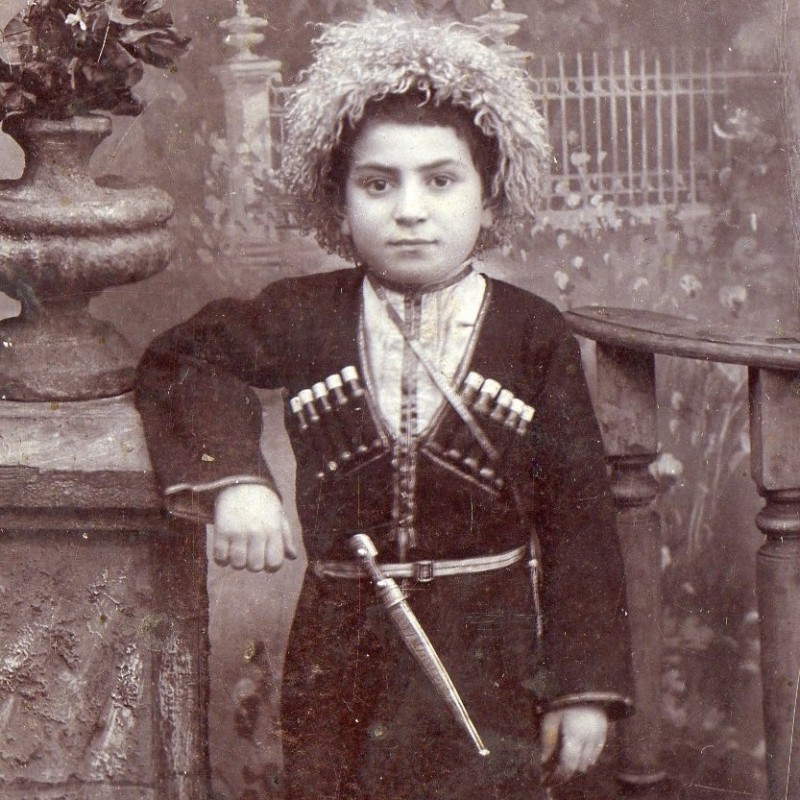 Photo of a boy in Azerbaijani national dress with a dagger, 1907
