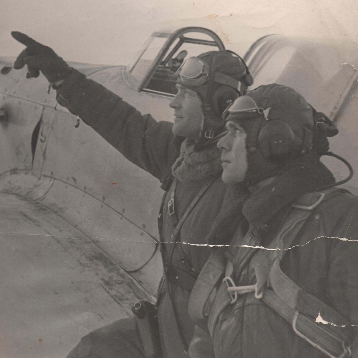 Large-format photo of Red Army pilots with a Mauser C96 pistol