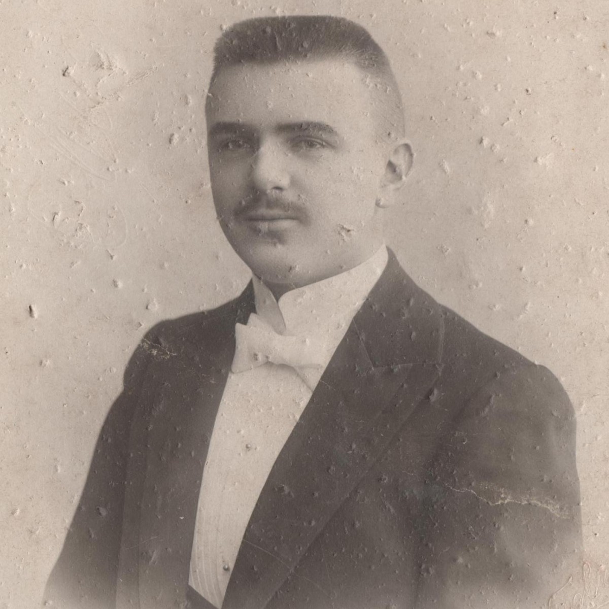 Portrait photo of a young man in a tuxedo