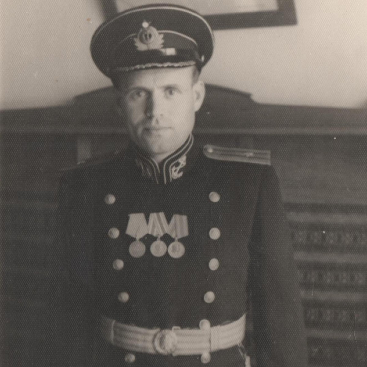 Photo of a captain of the 3rd rank of the USSR Navy in a ceremonial uniform of the 1945 model