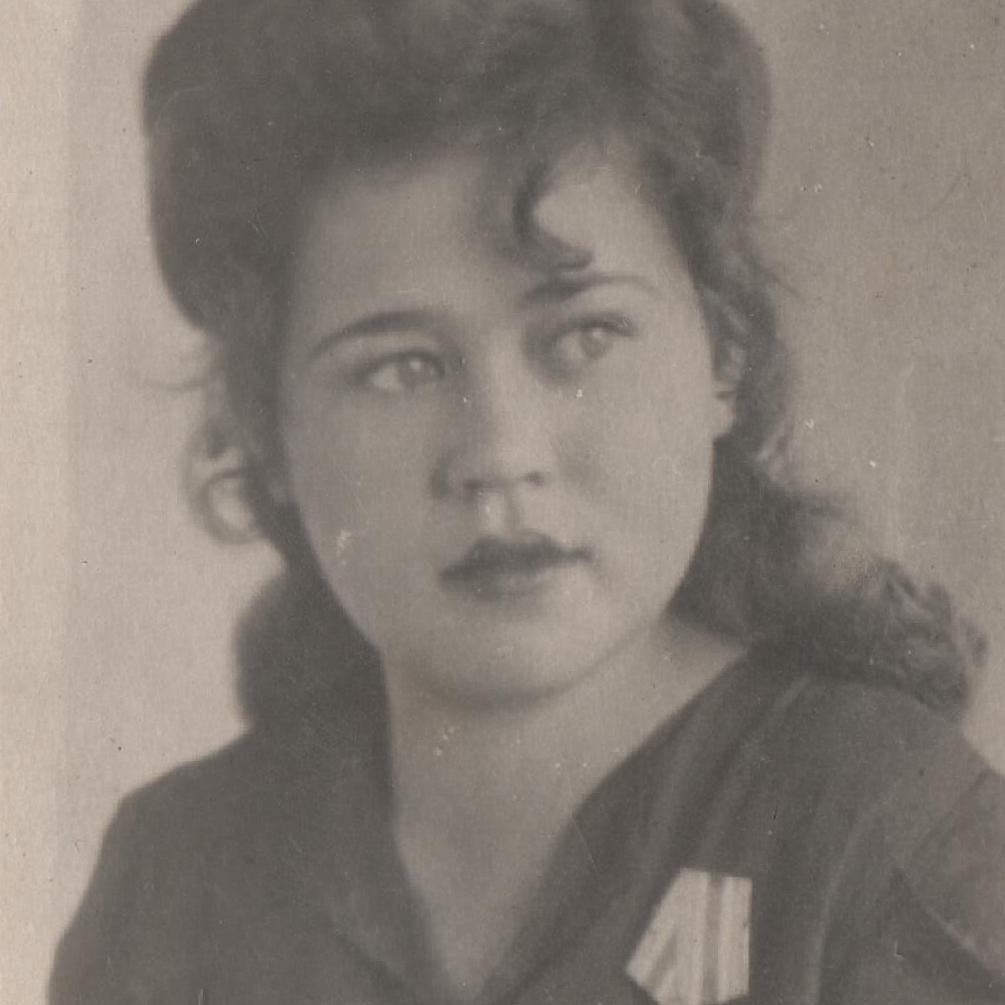 Photo of a girl with a medal "For the victory over Germany"