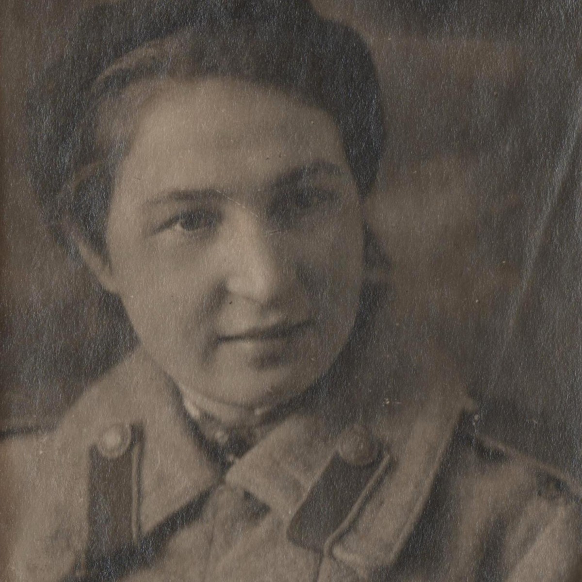 Photo of a girl – an ordinary Red Army soldier in a winter overcoat, 1943
