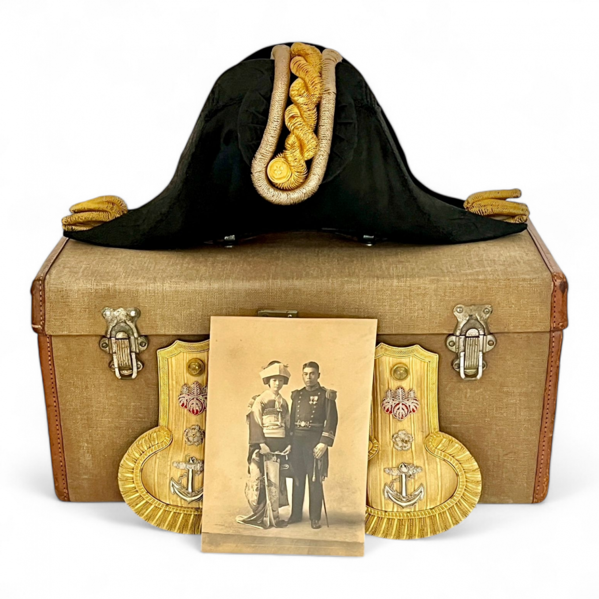 Two-cornered hat of an officer of the Imperial Japanese Navy with epaulettes, in a case