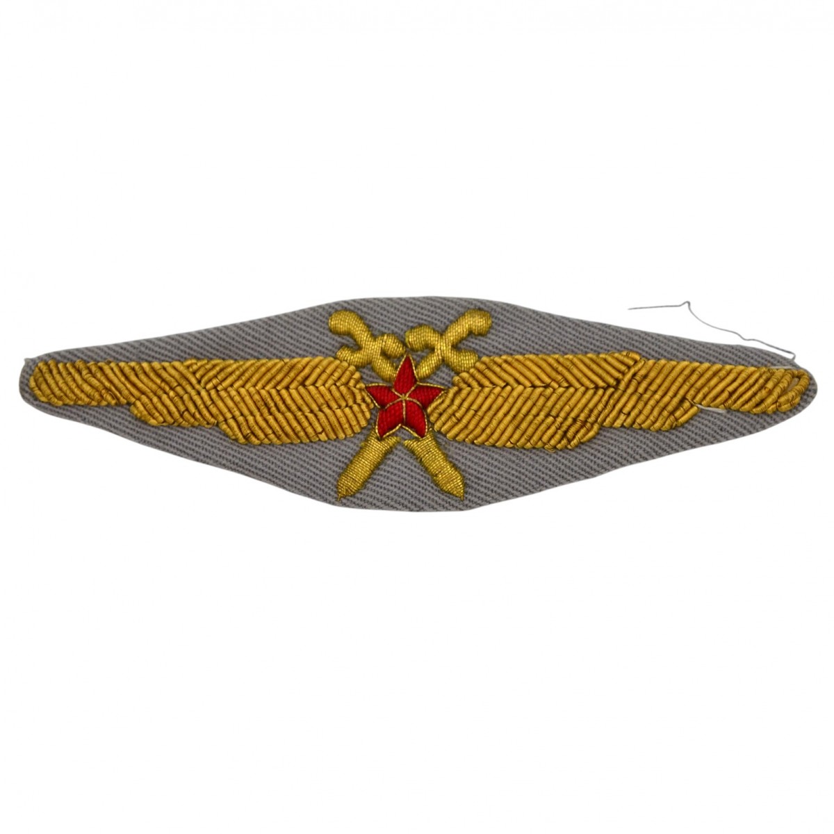 A sewn version of the SA Air Force pilot's badge of the 1949 model on the output uniform