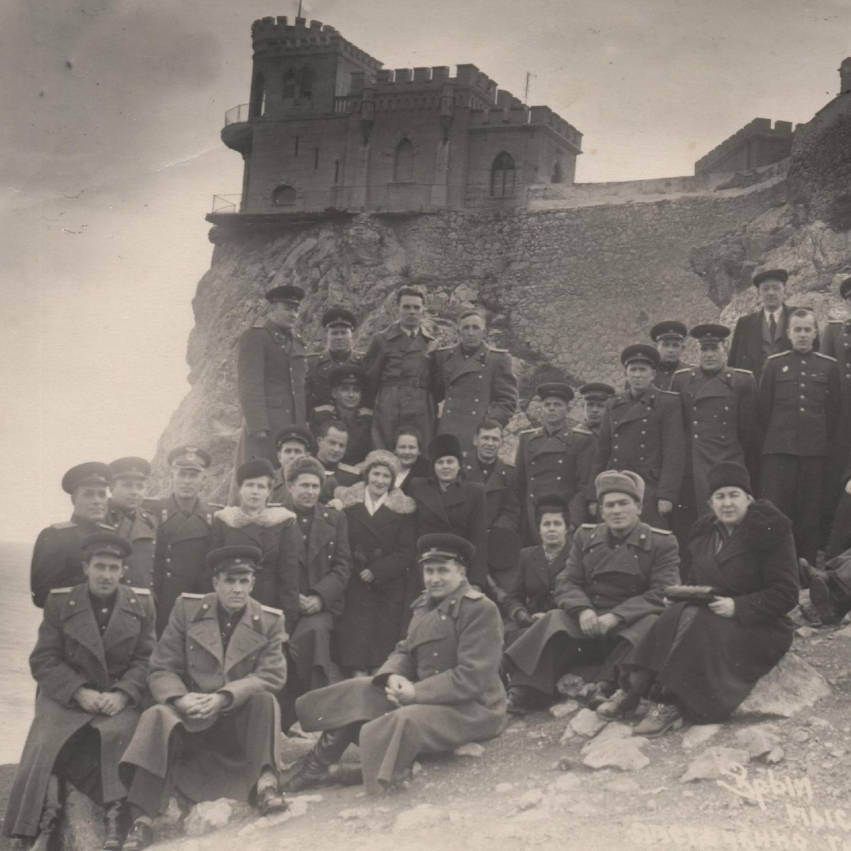 Group photo of SA officers against the background of a Swallow's nest in Crimea