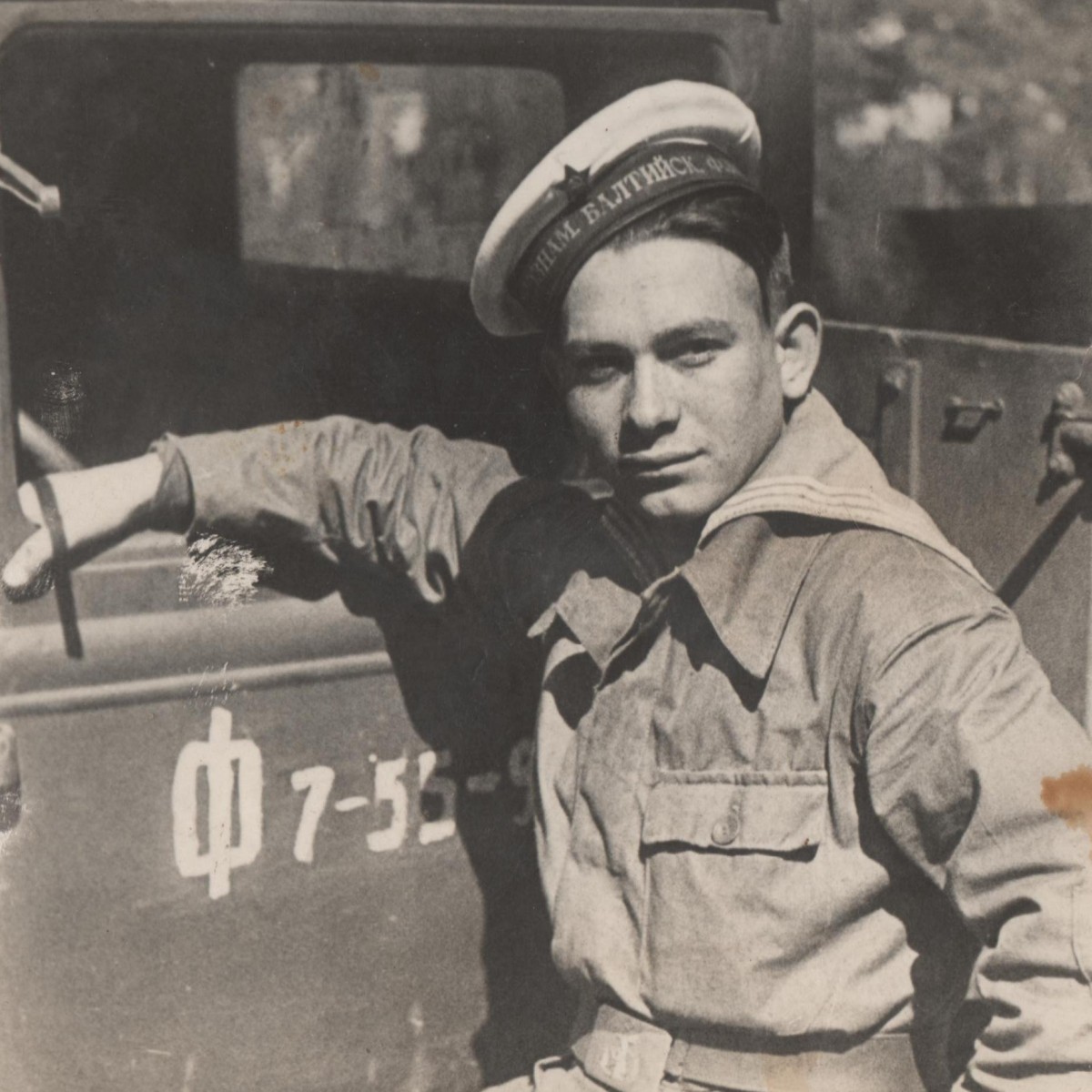 Photo of a sailor of the Red Banner Baltic Fleet at a truck