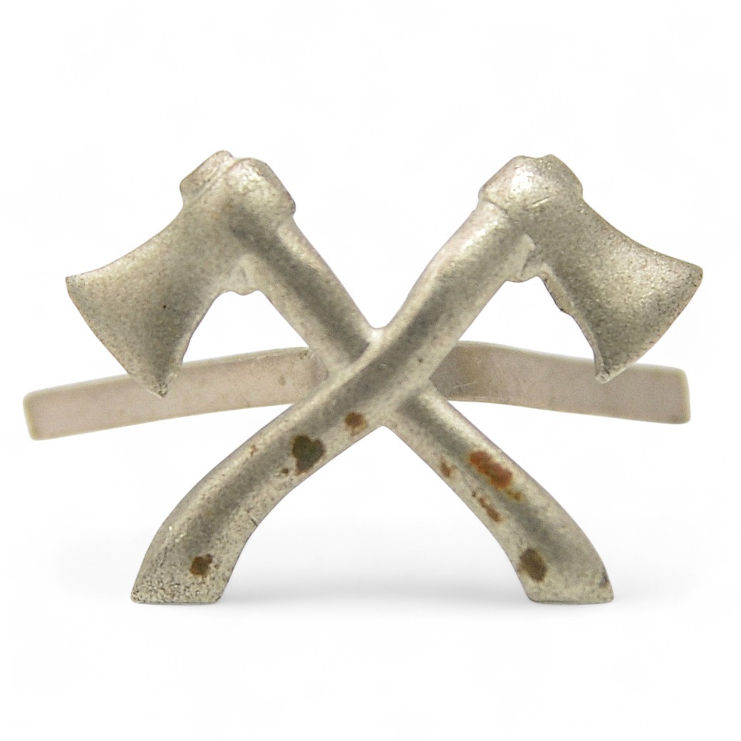 The emblem on the buttonhole of a military sapper of the Red Army in 1936