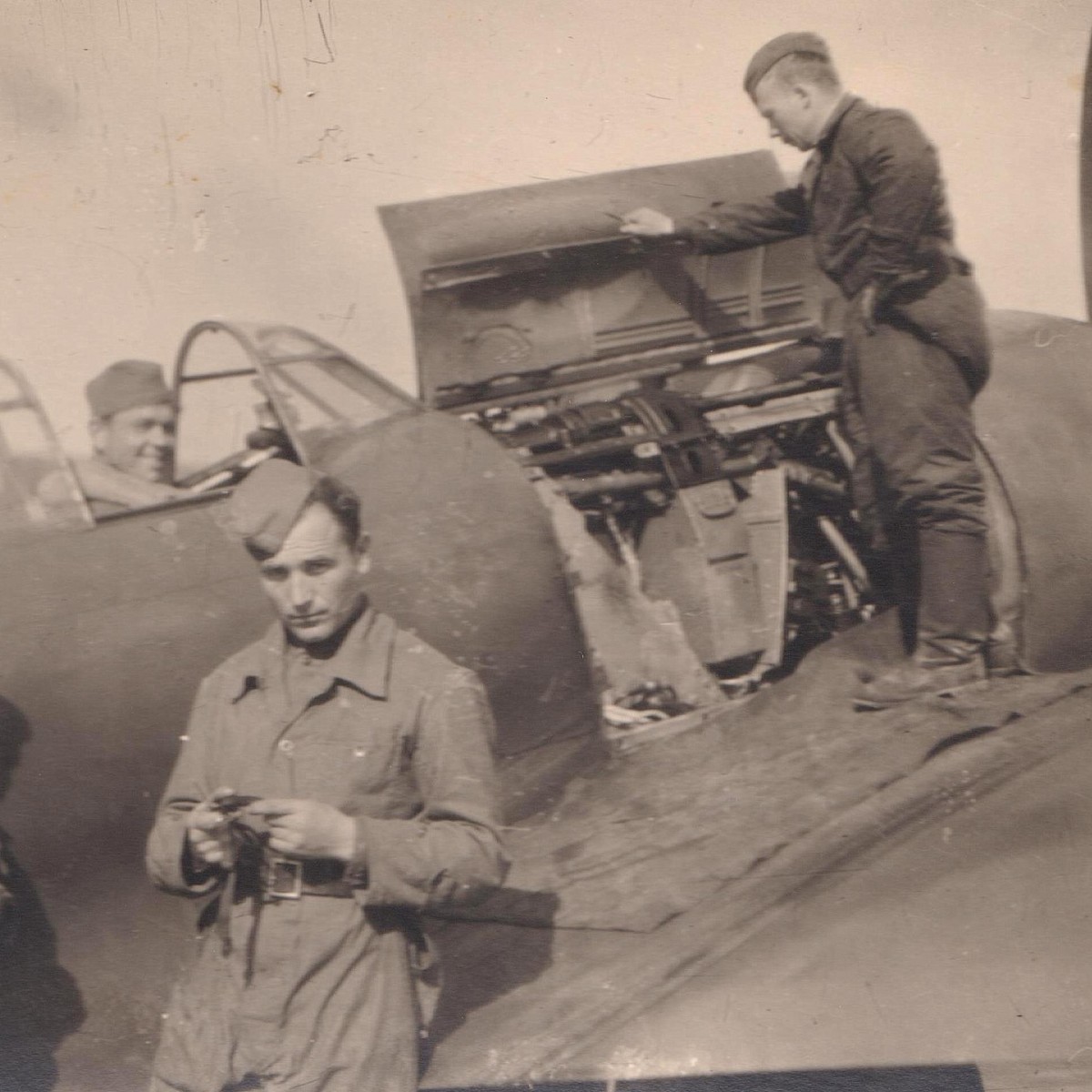 Photo of Red Army military technicians at a combat aircraft