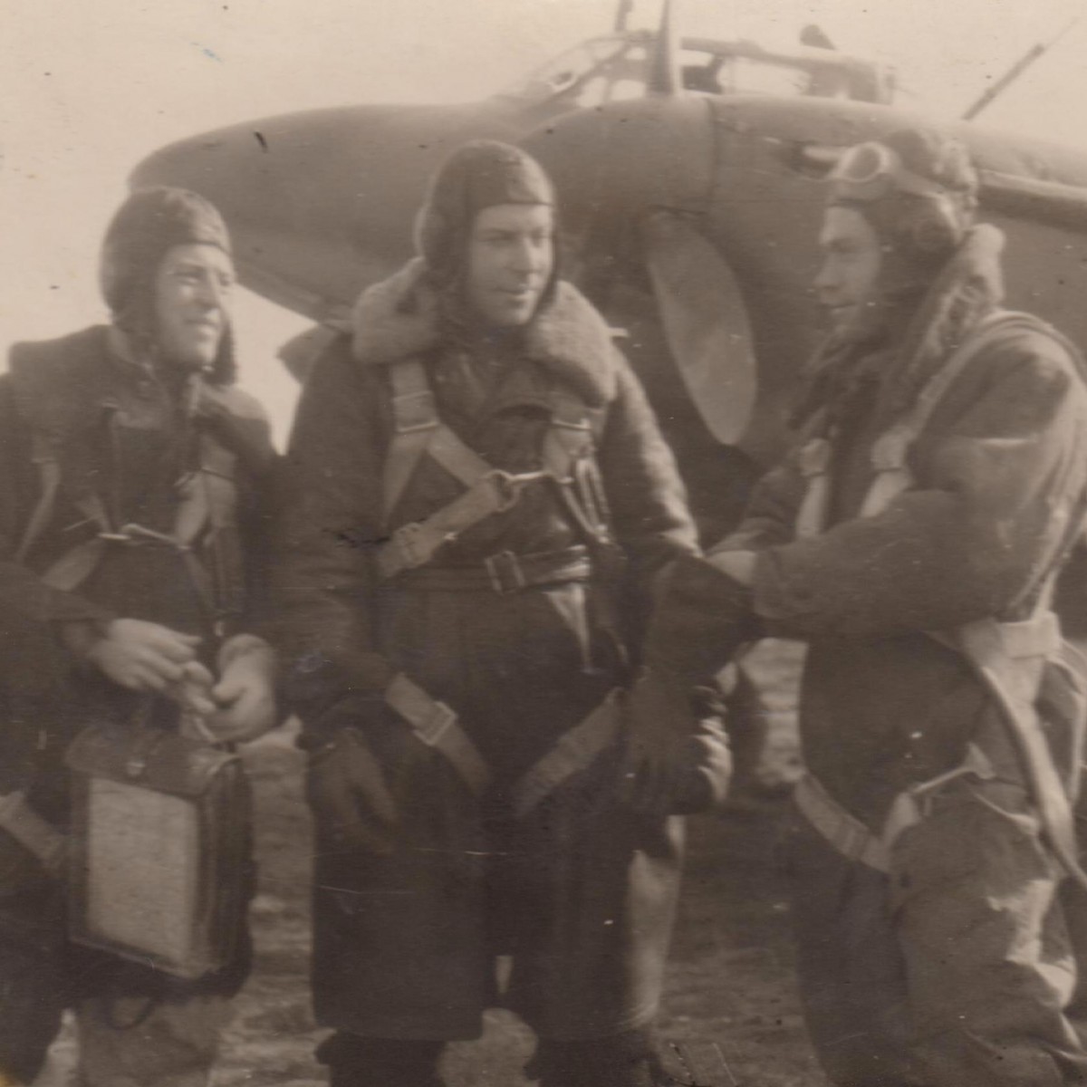 Photo of Hero of the Soviet Union V.V. Kibalko with his crew on the background of an airplane