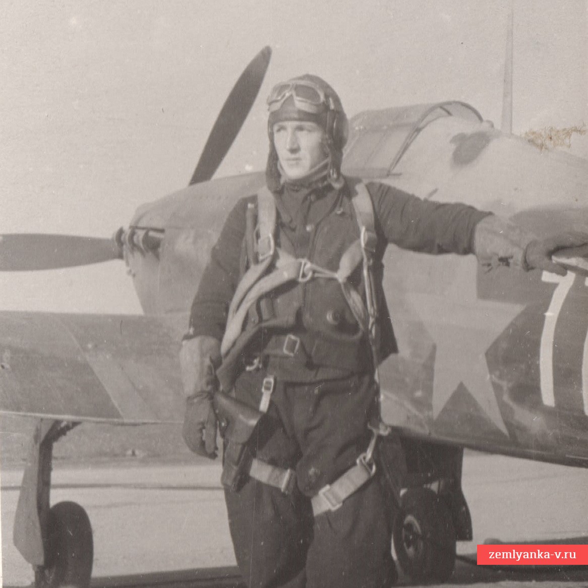 Photo of Red Army Air Force Captain P.G. Sgibnev, Hero of the Soviet Union, on the background of an airplane