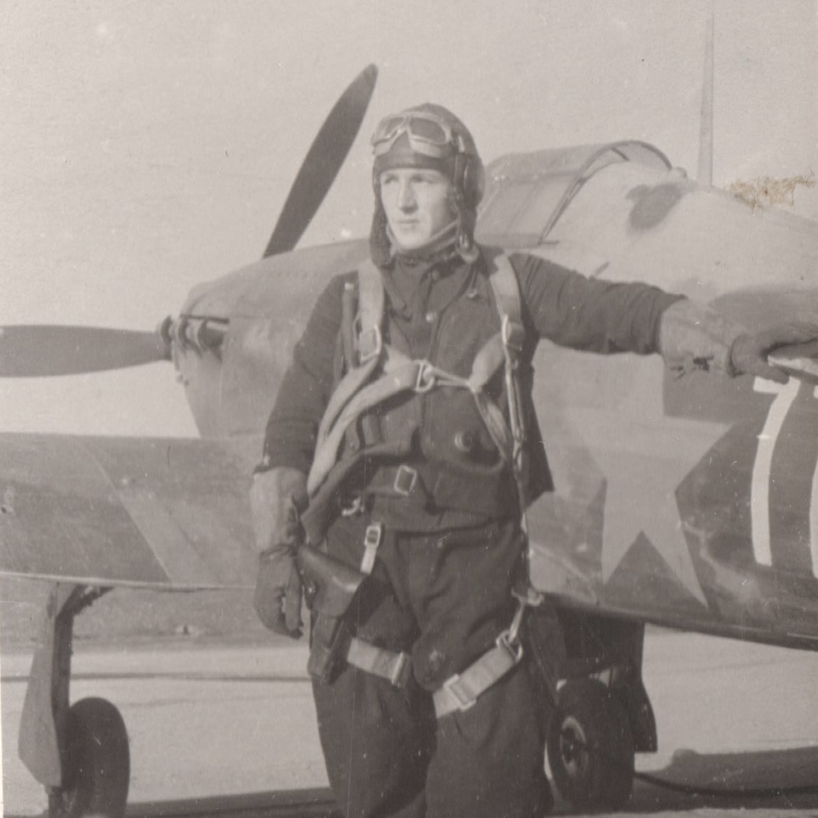 Photo of Red Army Air Force Captain P.G. Sgibnev, Hero of the Soviet Union, on the background of an airplane