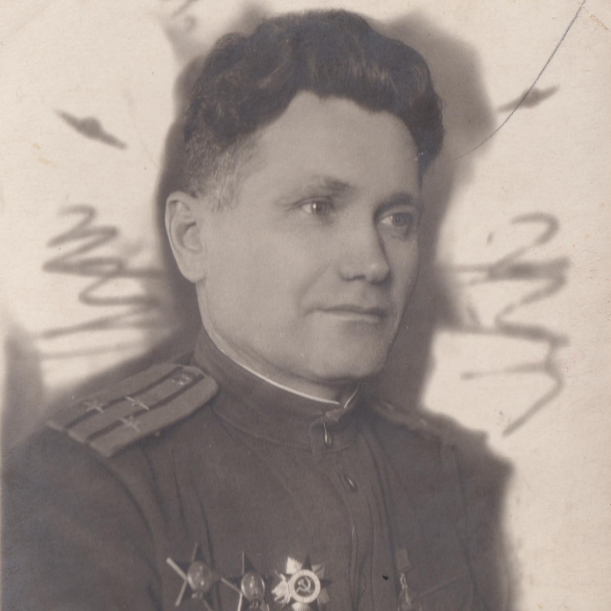 Photo of a lieutenant colonel of the Red Army Air Force with two orders of the Red Star and the Order of the Patriotic War