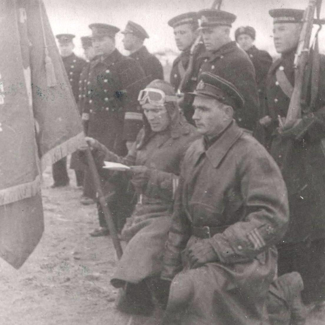 Photo of the first twice Hero of the Soviet Union B.F. Safonov at the banner