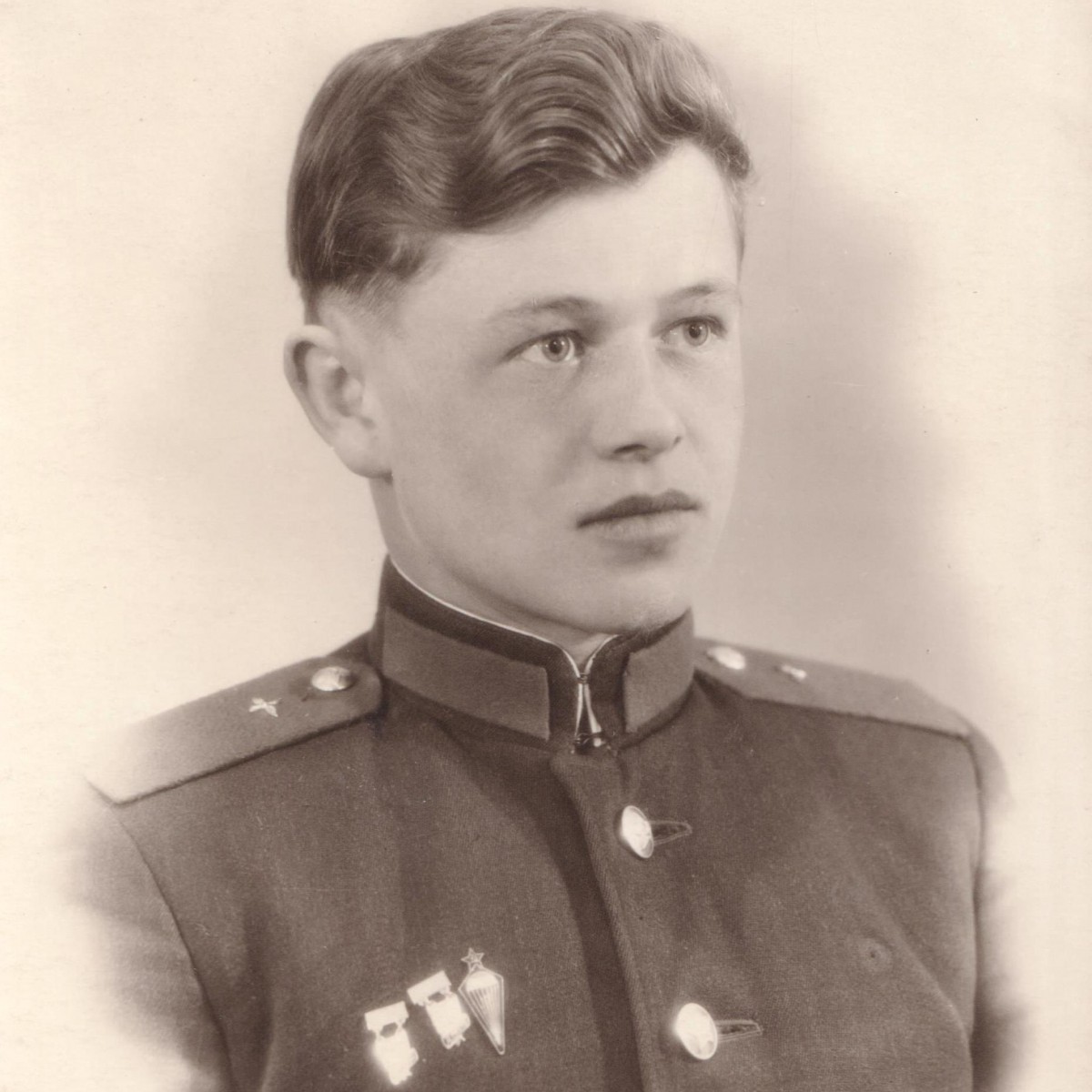 Photo of an Air Force private in a ceremonial uniform with sports badges