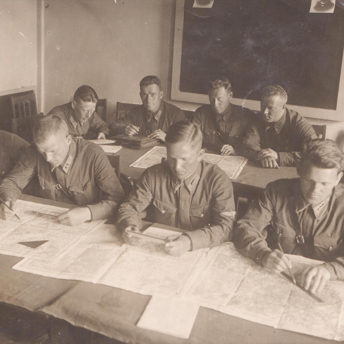 Photo of Red Army Air Force lieutenants studying maps, 1937