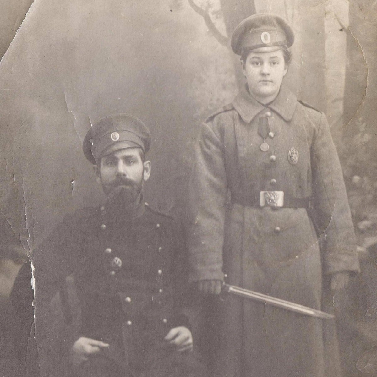 Photo of a girl in the uniform of a corporal of one of the RIA infantry regiments, with an Arisaka bayonet