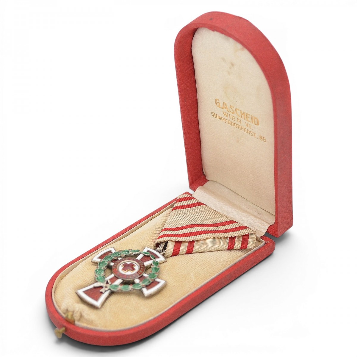 Honorary badge of the Austrian Red Cross II class with military distinction, in a case
