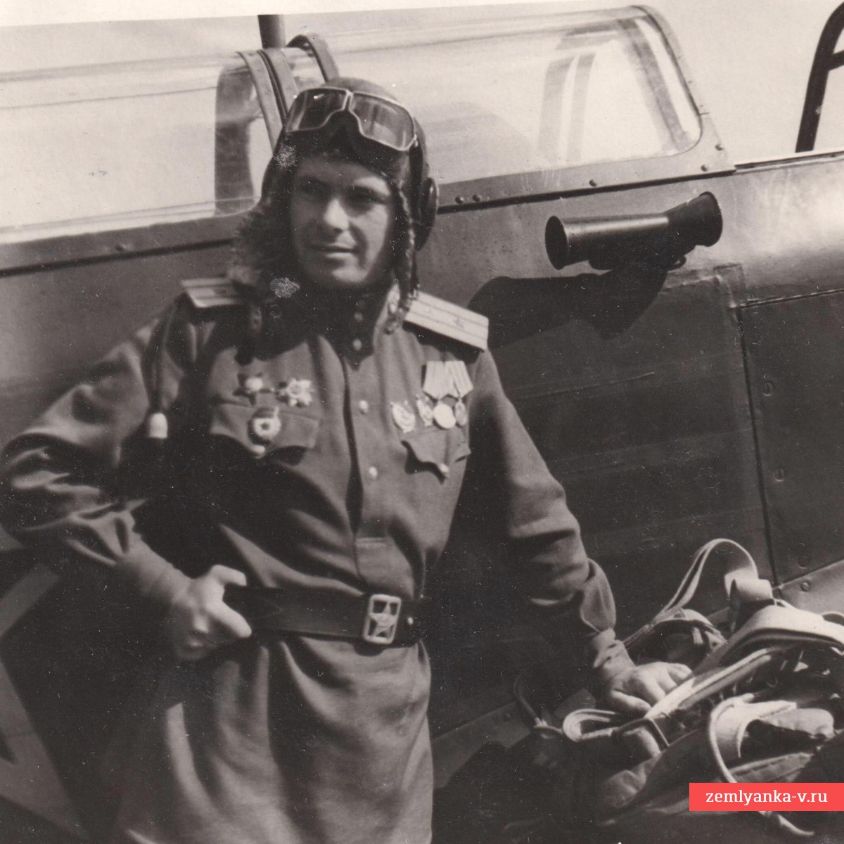 Photo of a major of the Red Army Air Force with awards at the plane