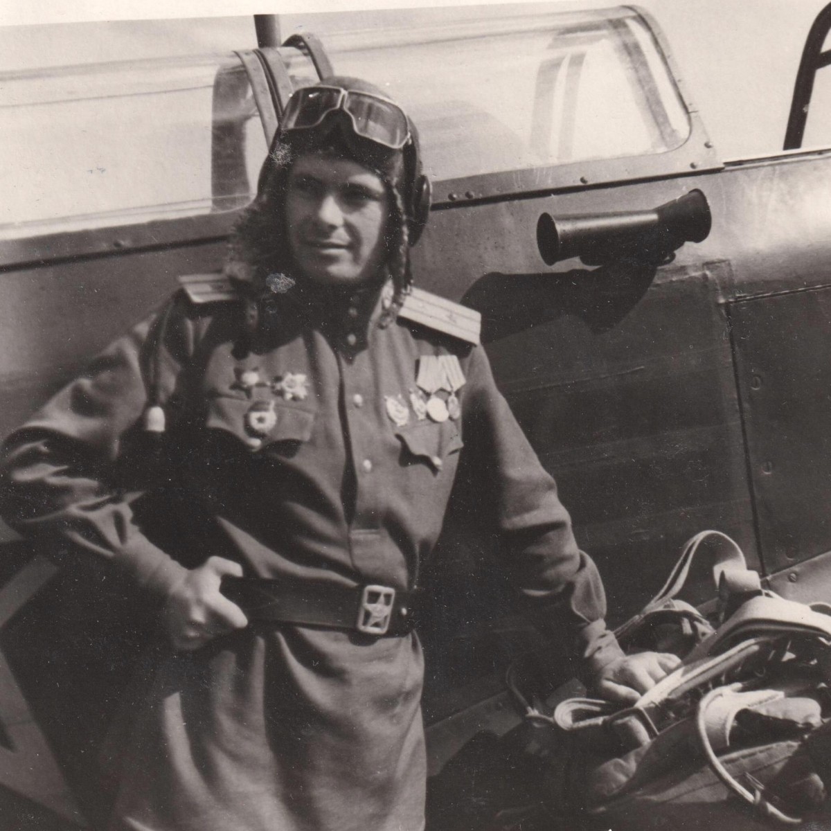 Photo of a major of the Red Army Air Force with awards at the plane